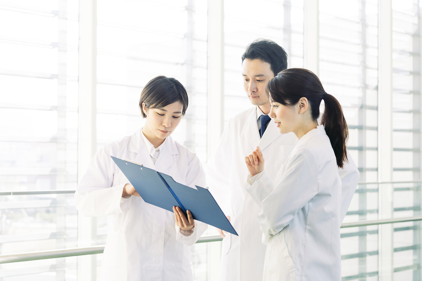 Doctors looking at a clipboard